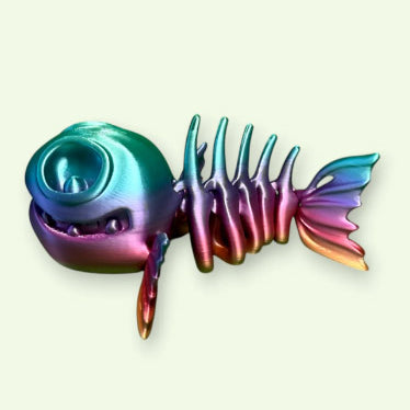 Colorful fish-shaped object on a light green background