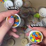 Colorful Cereal Clicker in hands, showcasing clickable bowl design with bright cereal pieces.